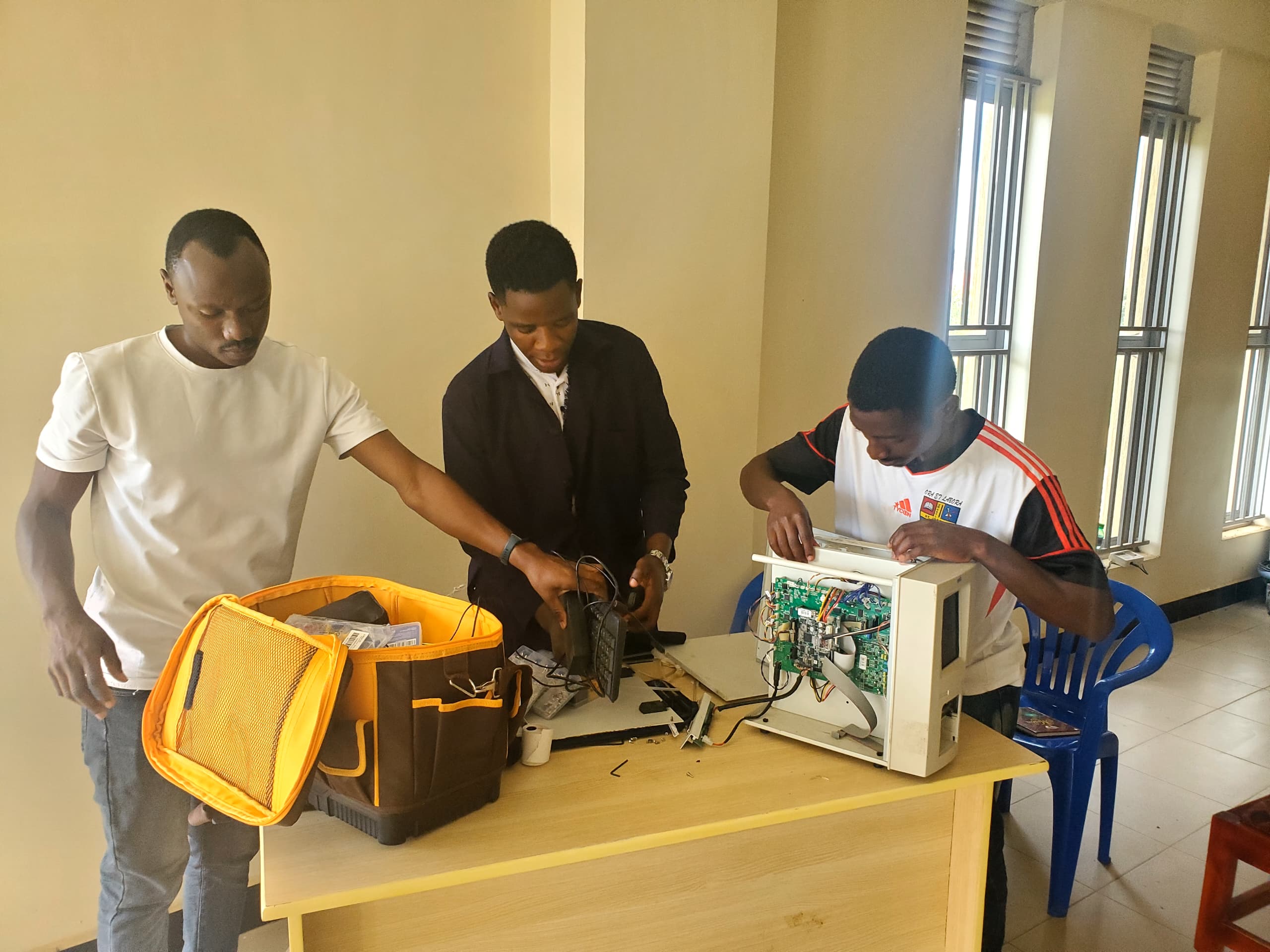 Team repairing medical equipment